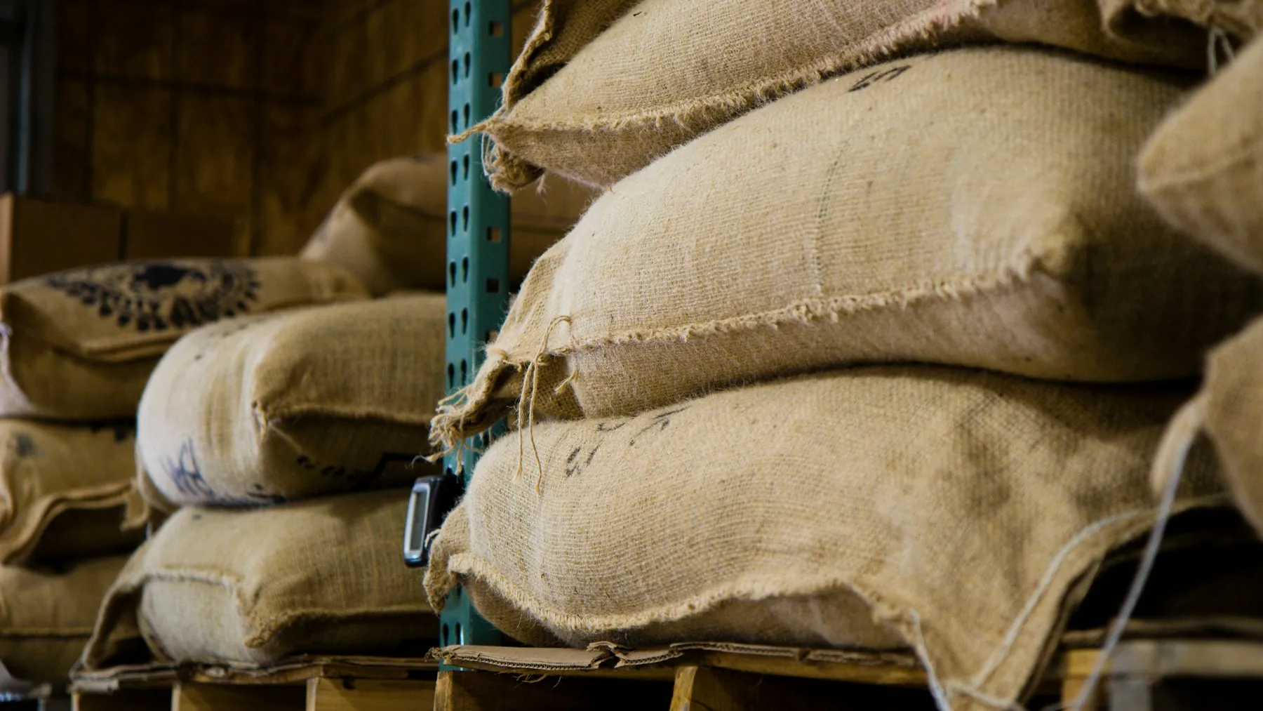 Jute sacks stacked on pallets in a warehouse
